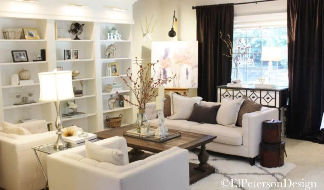 Fall living room with custom built ins and white furniture